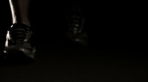 A runner gets his hands and feet ready at the starting line before taking off Video stock 33834354