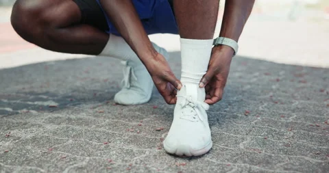 Runner, hands and ankle pain at in street with injury, fatigue and sprain with Stock Footage 301369599