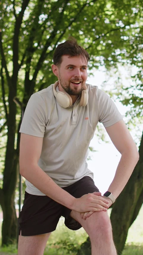 Runner jogger man starting smart watch timer and running checking heart rate Stock Footage 347055878