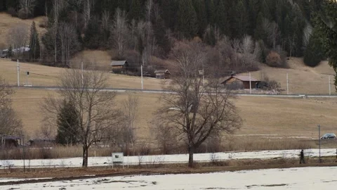 Runner jogging through snowy alpine countryside Stock Footage 332378246