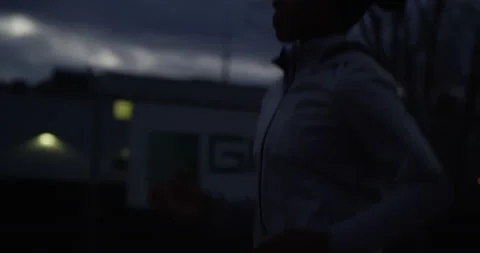 Runner jogs at night in profile 스톡 동영상 138378733