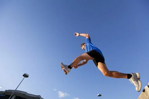 Runner jump at the city Stock Photos