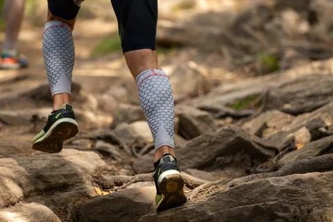 Runner legs in compression sleeves Stock Photos