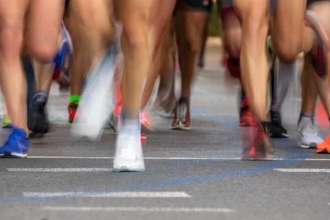 Runner legs front view in blurred motion Foto stock