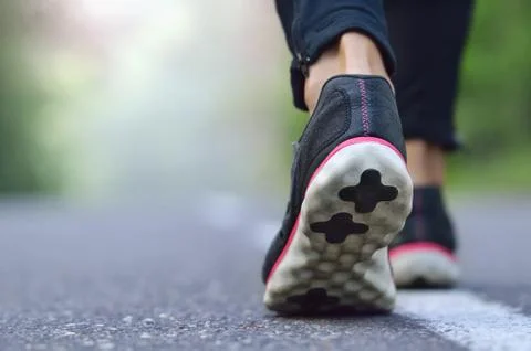 Runner legs on pathway in park Stock Photos