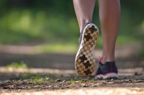 Runner legs on pathway in park Stock Photos