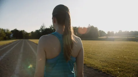 Runner looking at track before sunrise run, 4k slow motion Stock Footage 111156759