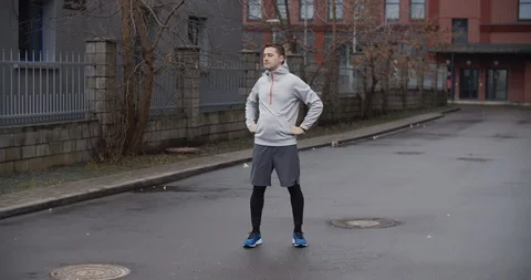 Runner man running on the road in the city. Handsome male athlete training Vídeo Stock 122241798