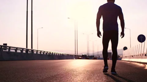 Runner man stretching and resting after running on  road.Handsome Caucasian m Stock Footage 67355226