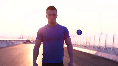 Runner man stretching and resting after running on  road.Handsome Caucasian m Stock Footage 67358970