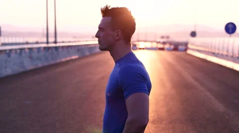 Runner man stretching and resting after running on  road.Handsome Caucasian m Video stock 67359779