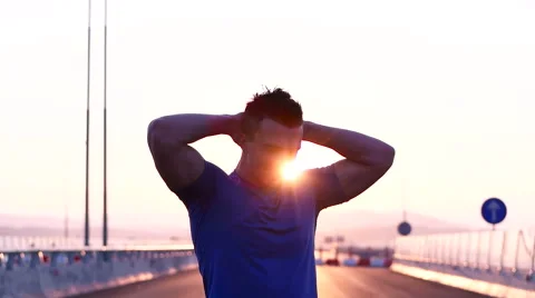 Runner man stretching and resting after running on  road.Handsome Caucasian m Video stock 67360614