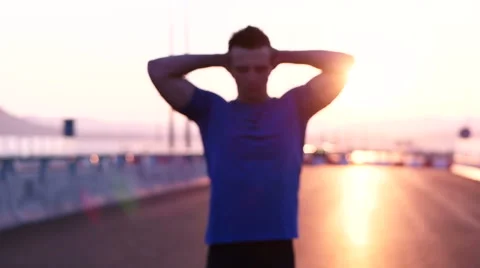 Runner man stretching and resting after running on  road.Handsome Caucasian m Video stock 67361055