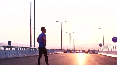 Runner man stretching and resting after running on  road.Handsome Caucasian m Video stock 67361968