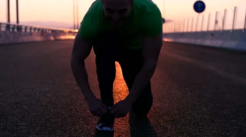 Runner man stretching and taking rest on road. Handsome Caucasian male fitnes Video stock 67365459