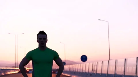 Runner man stretching and taking rest on road. Handsome Caucasian male fitnes Video stock 67365967