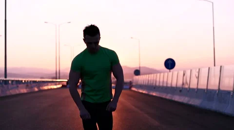 Runner man stretching and taking rest on road. Handsome Caucasian male fitnes Video stock 67366311
