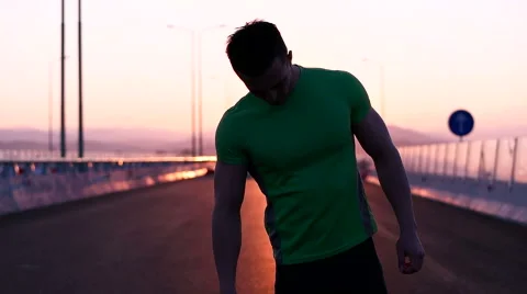 Runner man stretching and taking rest on road. Handsome Caucasian male fitnes Video stock 67366550