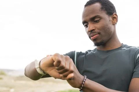 Runner in the park preparing for jogging. Stock Photos