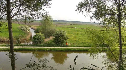 Runner on the path  in the small Dutch town Sluis. Stock Footage 38005571
