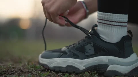 Runner Preparing Outdoors, Runner Adjusting Sneakers Before Evening Run, Athlete 스톡 동영상 323931007