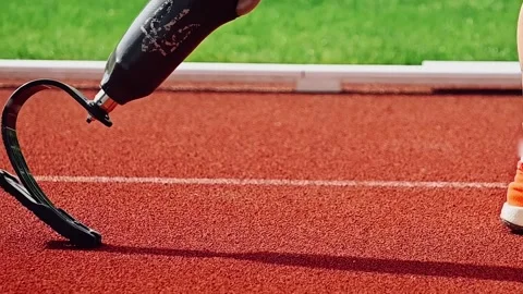 A runner with a prosthesis in the starting position, close-up Stock Footage 241179124
