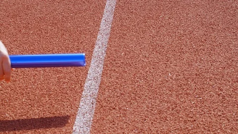 Runner putting hands for relay running, 75 fps slow motion Stock Footage 89734278