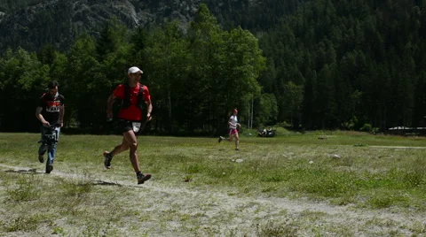 Runner reaching checkpoint Mont Blanc 80K Stock Footage 53586721