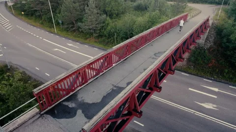 Runner on red bridge Stock Footage 278733046