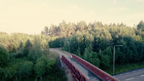 Runner on a red bridge Stock Footage 278733047