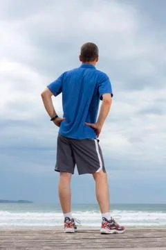Runner relaxing on a beach Stock Photos