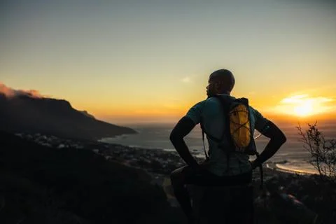 Runner relaxing on trail path on a mountain Stock Photos