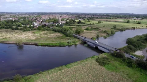 Runner running across Harrington Bridge, Northampton, England by drone Stock Footage 292012208