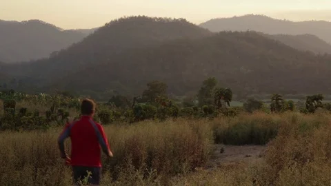 Runner running in mountains of Thailand at sunset Stock Footage 79081988