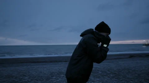 Runner runs away from a camera. Training on open air at nasty weather Stock Footage 147926026