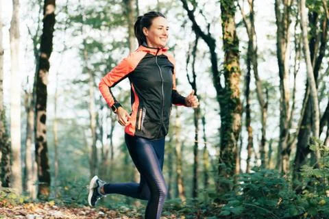 Runner runs in the forest Stock Photos