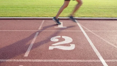 The runner runs through the finish line Stock Footage 89328770