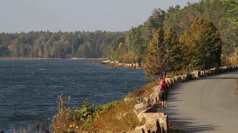 Runner in scenic road next to the ocean Stock Footage 28654063
