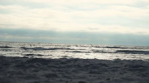 Runner on the seacoast against sunset Видео 70139298