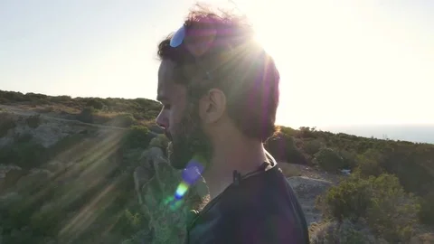 Runner standing on top of a cliff on an island in front of the ocean 스톡 동영상 80235695