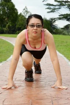 Runner in starting stance Stock Photos