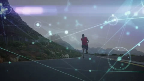 Runner starting uphill on mountain highway as digital nodes tracking real-time Stock Footage 313242807