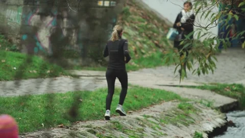 Runner by a stream Szentendre, Hungary Stock Footage 166222227
