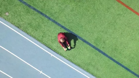 Runner Stretching Aerial Stock Footage 61169340