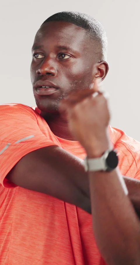 Runner, stretching and arm with black man in studio for health, fitness and Stock Footage 320453920