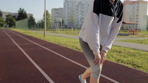Runner stretching and warming up leg Stock Footage 143806172