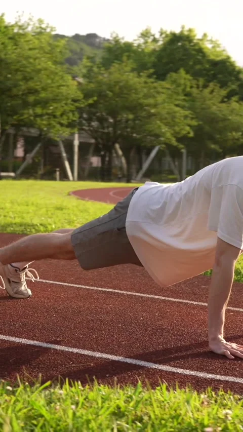 Runner stretching and warming up before run outdoors Stock Footage 299896622