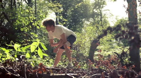 Runner stretching his legs in the forest Stock Footage 41093879
