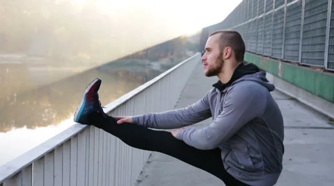 Runner stretching legs Stock Footage 57819206