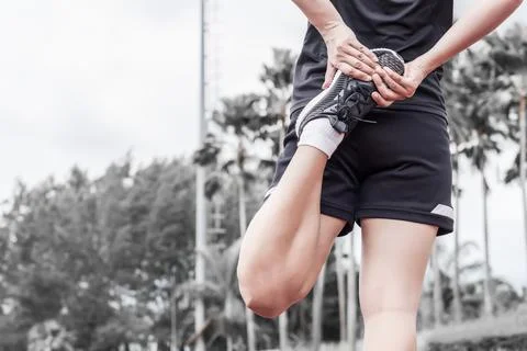 Runner stretching warm up before exercise, Sport and activity concept Stock Photos